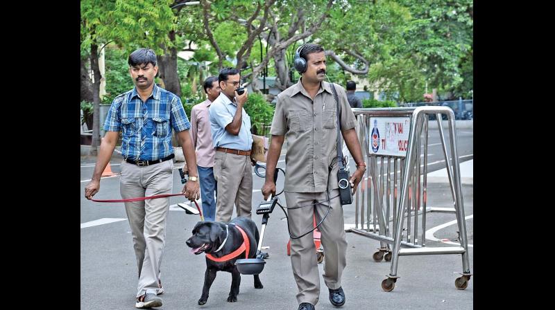 Police conduct checks with sniffer dogs at the Secretariat complex