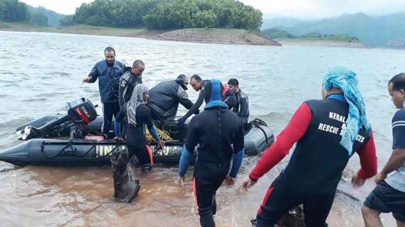 The navy team during search operations at Banasura Sagar Reservoir, Wayanad on Wednesday.
