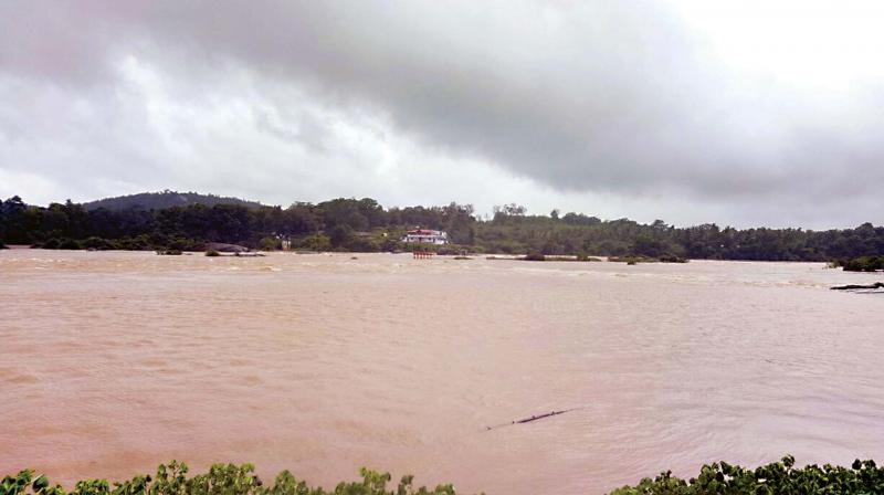 Tunga river overflows at Theerthahalli near Shivamogga on Thursday 	(Photo:  KPN)