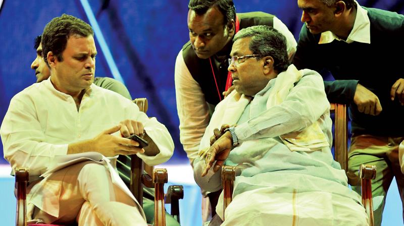 Congress vice-president Rahul Gandhi in conversation with CM Siddaramaiah at a conference on Dr B.R. Ambedkar  Quest for Equity in Bengaluru on Friday (Photo: DC)