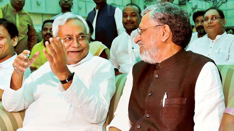 Nitish Kumar and Shushil Kumar Modi after they were sworn-in as Bihar CM and Dy CM respectively, in Patna on Thursday  (Photo:  AP)