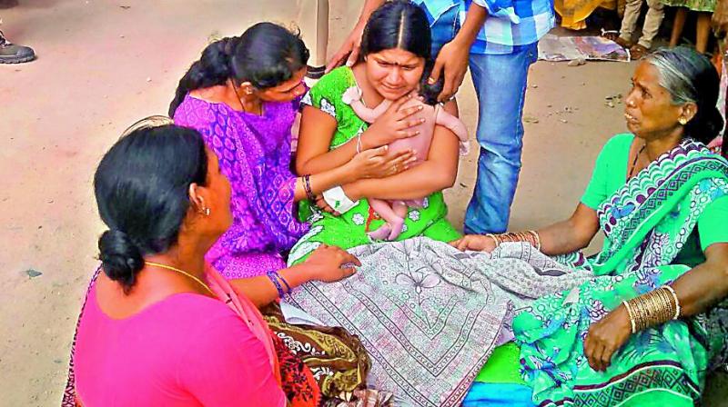 Close relatives of the deceased infant wail over their misfortune at the Government Maternity Hospital in Koti on Thursday (Photo: DC)