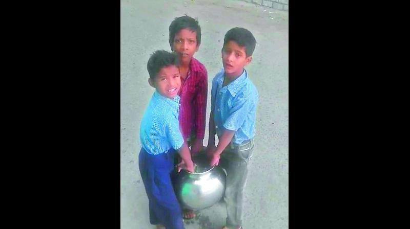 Primary school students forced to fetch water for the Government primary school at Chawni Nade Ali Baig in Old City  (Photo: DC)