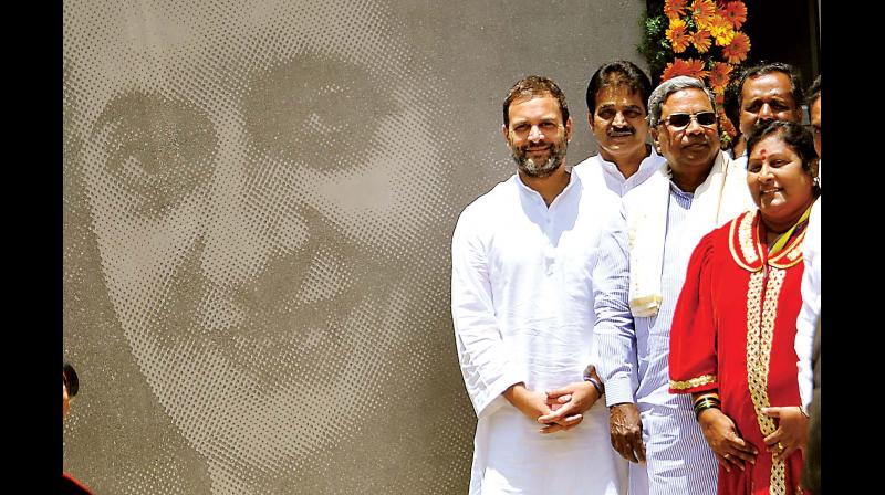 AICC Vice President Rahul Gandhi with Chief Minister Siddaramaiah and Mayor G Padmavathi during the inauguration of Indira Canteen, at Jayanagar in Bengaluru on Wednesday