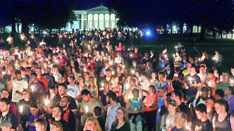 University of Virginia students, faculty and residents attend a candle light march across grounds in Charlottesville, on Thursday. Hundreds gathered on the campus for a candlelight vigil against hate and violence days after Charlottesville erupted in chaos during a white nationalist rally (Photo: AP)