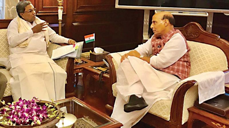 Chief Minister Siddaramaiah with Union Home Minister Rajnath Singh in New Delhi on Thursday  (Photo: DC)