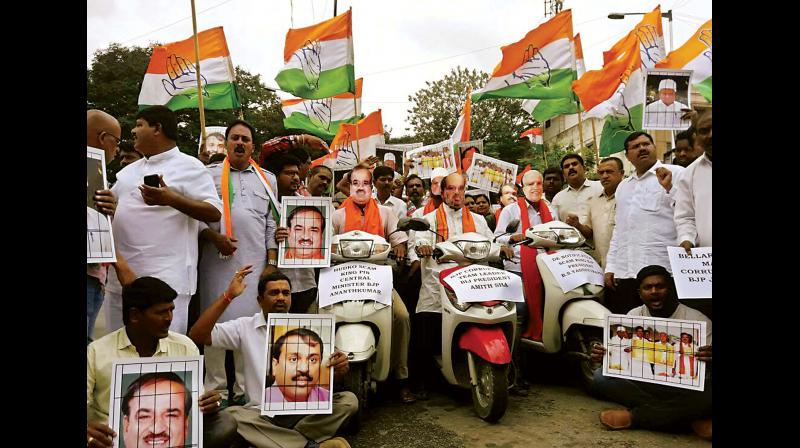 Youth Congress workers take out a protest against BJP leaders in Bengaluru on Friday