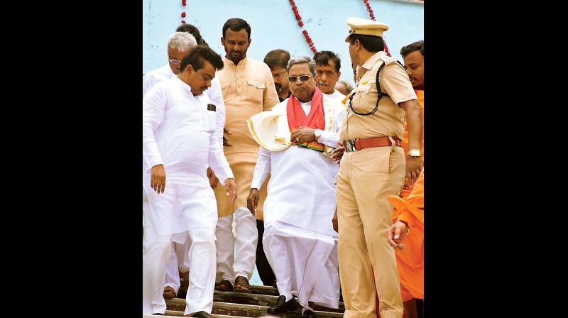 Chief Minister Siddaramaiah arrives to offer bagina to river Krishna at Almatti dam in Bagalkote on Friday. Water resources minister M.B. Patil was also present