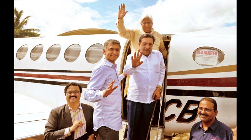 Ministers Krishna Byregowda, M.R. Seetharam and H.K. Patil board the cloud-seeding aircraft at Jakkur airfield in Bengaluru on Monday(Photo: DC)