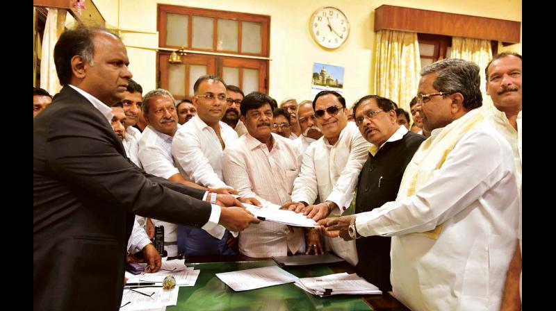 Congress leader C.M. Ibrahim submitting nomination papers for Council polls along with CM Siddaramaiah, KPCC president Dr G Parameshwar and Public Works Minister Dr H.C. Mahadevappa in Bengaluru on Monday