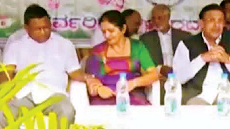 Kodagu Congress leader T.P Ramesh seen holding MLC Veena Achaiahs hand during I-Day function in Madikeri