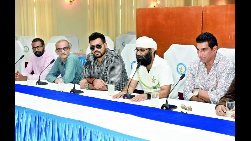 The Great Indian Escape movie director Taranjiet Singh (second right) and Wg.Cdr Vidyadhar Shankar Chatti (rtd.) (second left) speak at the Dundigal Air Force Academy on Sunday (Photo: DC)