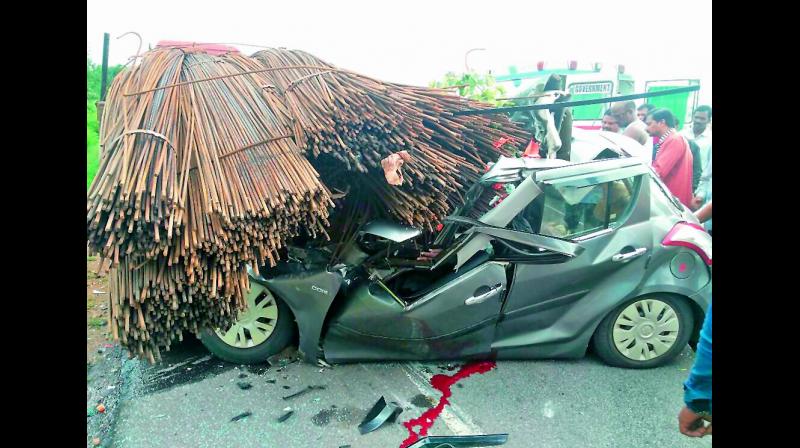 The car that rammed into the trailer truck on Rajiv Rahadari Highway in Siddipet on Sunday.