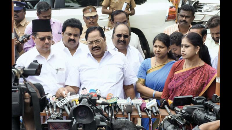 DMK floor leader Durai Murugan and MP Kanimozhi talk to media persons after meeting Governor Ch Vidyasagar Raoon Sunday (Photo: DC)