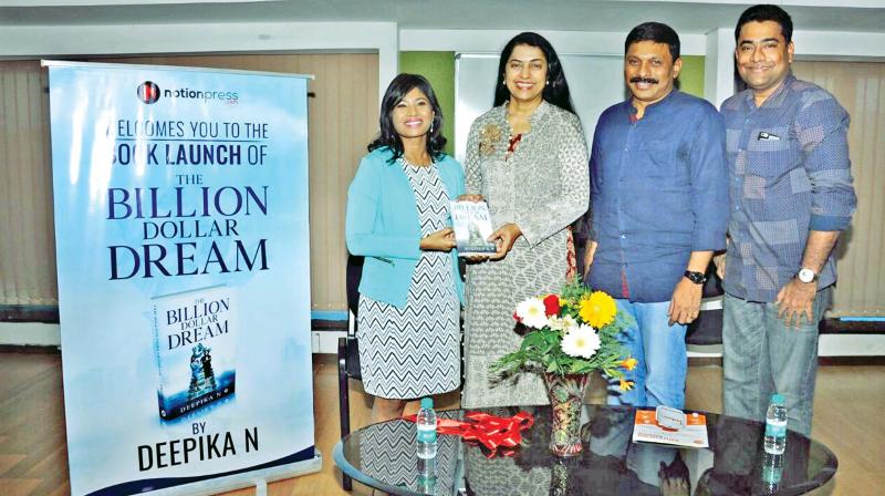 Actor Suhasini Maniratnam hands over a copy of the book to visually-challenged author N. Deepika at Anna Centenary Library on Saturday. B. Anil Kumar, GM, HR, Southern region, Indian Oil is also seen (Photo:DC)