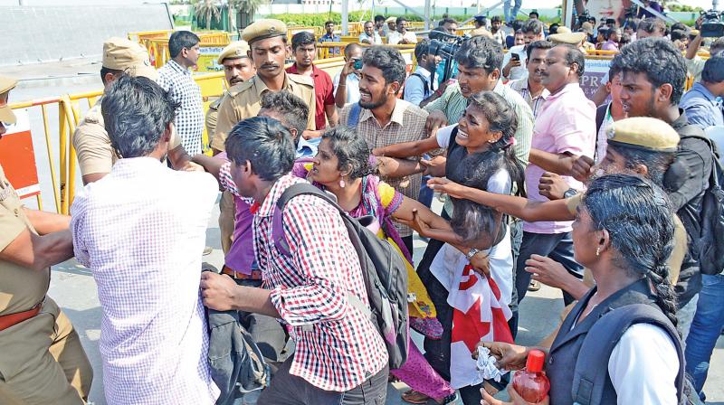 Police try to control members of Students Federation of India demonstrate against Neet at late Chief Minister J. Jayalalithaas memorial on Wednesday (Photo:DC)