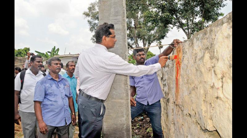 Archaeological Survey of India officials demark the site during the survey conducted in Pallavaram on Wednesday (Photo: DC)