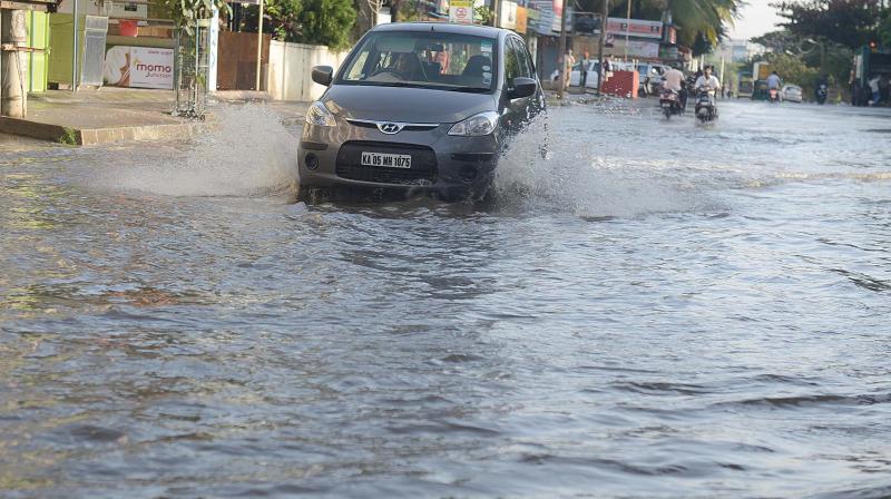 Heavy rain lashed Bengaluru on Saturday night flooding many roads in the city (Photo: DC)