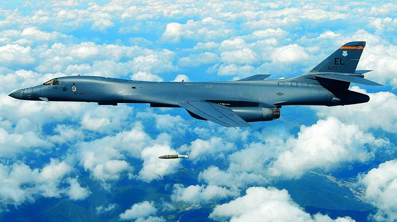 US Air Force B-1B bomber drops a bomb as it flies over the Korean Peninsula during a joint drill