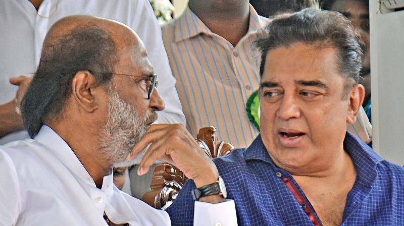 Actors Rajinikanth and Kamal Hassan share a moment at the unveiling of Sivaji Ganesan memorial in Chennai on Sunday (Photo: DC)