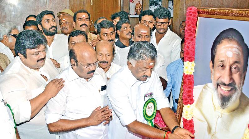 Deputy chief minister O. Panneerselvam pays floral tributes to Sivaji Ganesan at the memorial here on Sunday. Fisheries  minister  D. Jayakumar and actor Prabhu are seen (Photo: Representational Image)