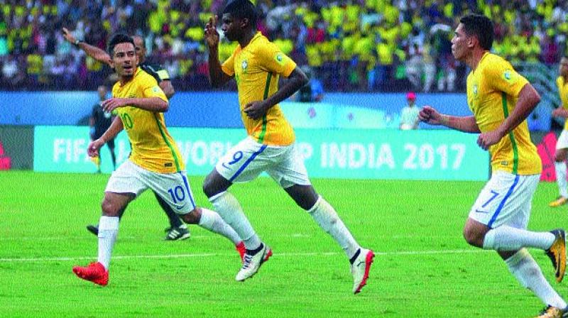 Brazils Lincoln (centre) celebrates with team-mates after scoring against Spain in their U-17 World Cup match at the Jawaharlal Nehru Stadium in Kochi on Saturday. Brazil began their campaign with a come-from-behind 2-1 victor (Photo: Sunoj Ninan Mathew)