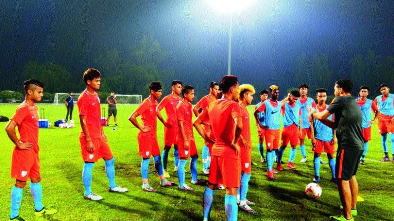 Members of the Indian team at a practice session in New Delhi on Sunday, the eve of their Group A match against Colombia