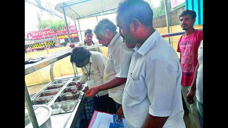 Food safety officials take samples of cooked food items for analysis at a hotel as part their drive to inspect hotels and restaurants in Rajahmundry on Monday (Photo: DC)