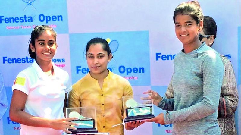 Y Sai Dedeepya (left) and her partner Sara Yadav (right) receive runners-up trophies from gymnast Dipa Karmakar in New Delhi.