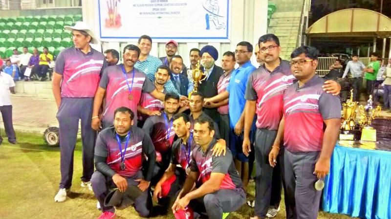 The Andhra Pradesh & Telangana lawyers team pose with the runners-up trophy at the conclusion of the XX All India High Court Lawyers Cricket tournament at the Vijay Path Stadium in Noida, New Delhi