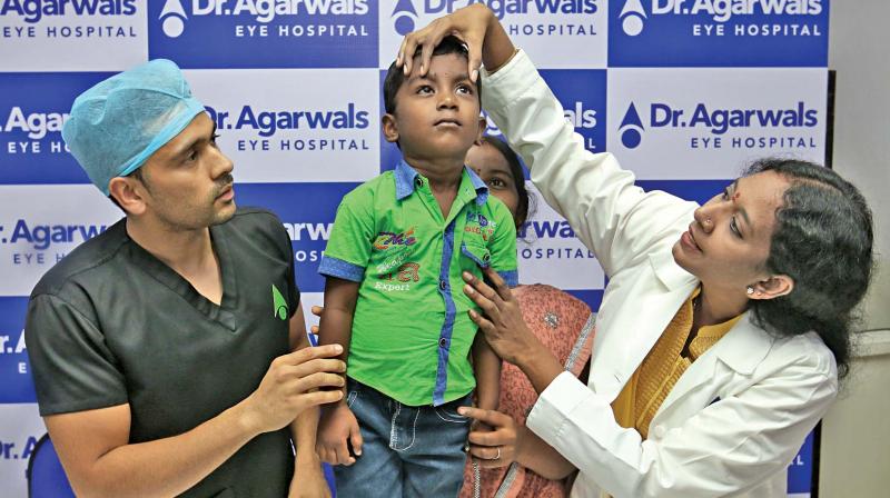 Dr Ashvin Agarwal, ED and Dr Manjula Jayakumar, paediatric ophthalmologist, with the 4-year-old boy after his eye disorder surgery (Photo: DC)