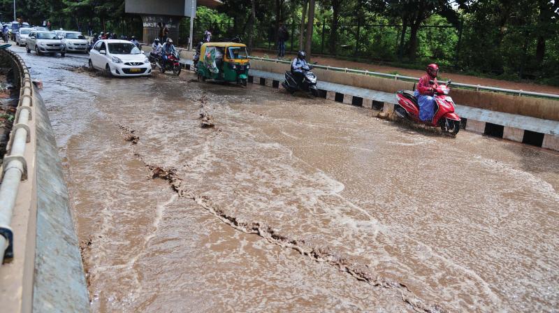Commuters struggle as rainwater collects below the Hebbal flyover