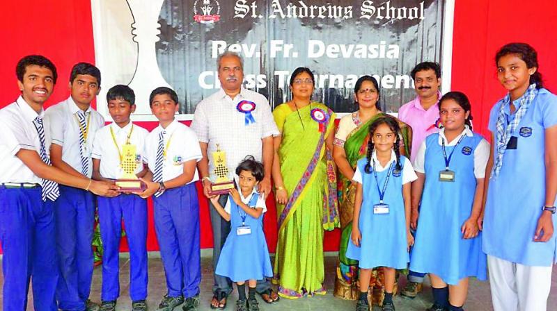 Winners pose with their trophies at the conclusion of the 14th Rev Fr Devasia Inter-School Chess tournament organised by St Andrews School.