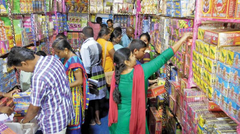 Visitors purchase firecrackers at a shop in Island grounds on Sunday (Photo: DC)