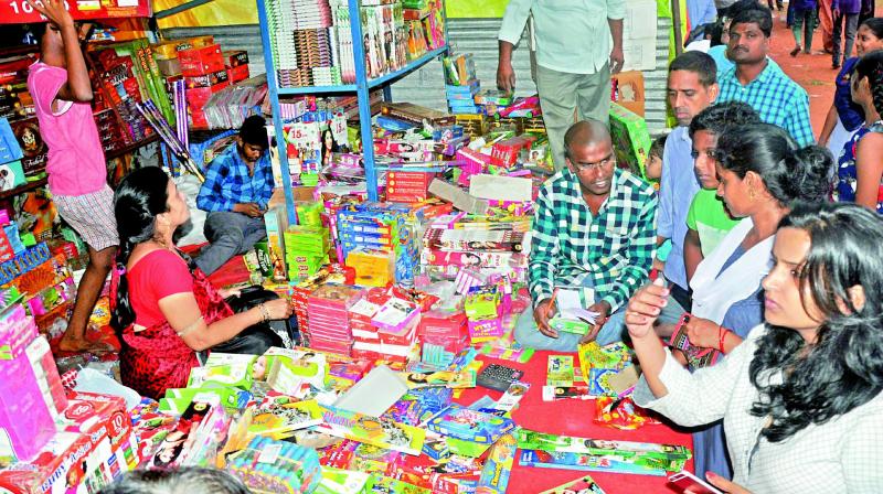 People purchase firecrackers to celebrate Diwali in Vizag on Wednesday. (Photo: DECCAN CHRONICLE)