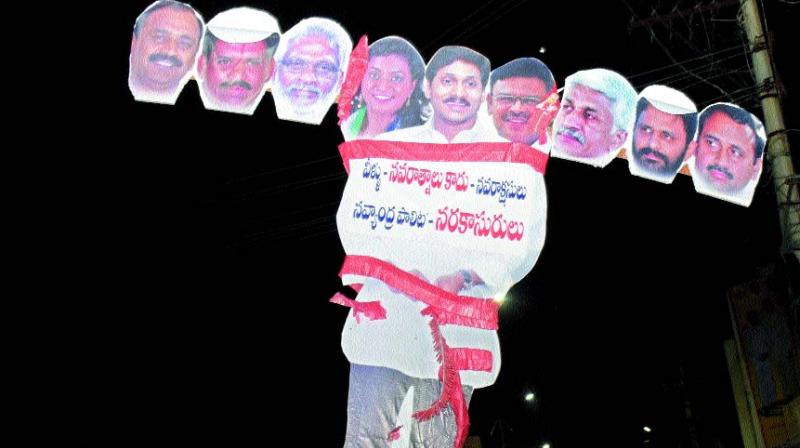 TD leaders try to torch the effigy of YSRC chief Y.S. Jagan Mohan Reddy and other party leaders, as part of Narakasura Vadha, on the eve of Diwali in Guntur on Wednesday. (Photo: DC)
