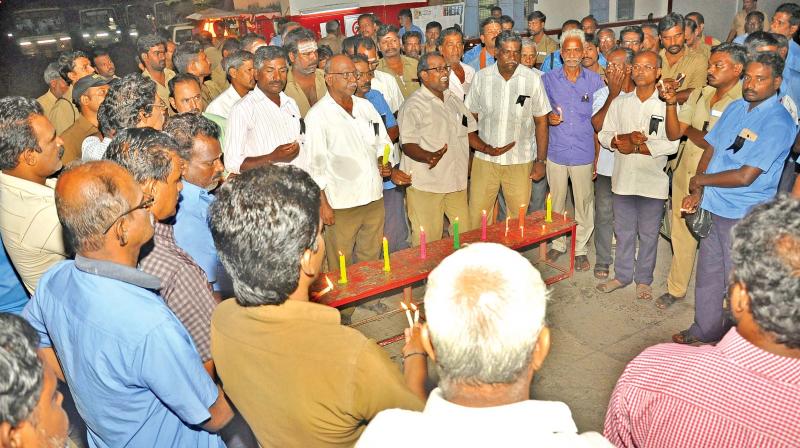 Members of Transport Union on Saturday pay homage to the deceased in Porayur accident, at Vadapalani bus depot.(Photo: DC)