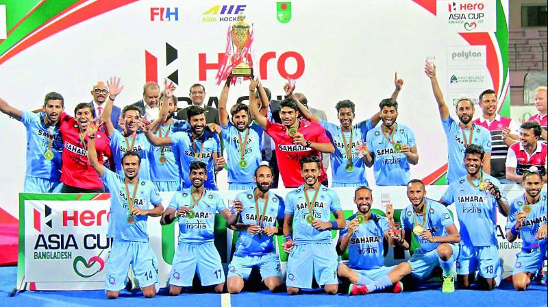 Indian hockey players pose with the trophy after winning the Hero Asia Cup 2017 at the Maulana Bhashani National Hockey Stadium in Dhaka, Bangladesh, on Sunday. India beat Malaysia 2-1 in the final.(Photo: PTI)
