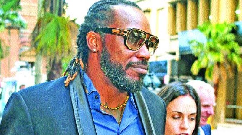 Chris Gayle leaves the NSW Supreme Court after the opening day of his defamation action. (Photo: AFP)