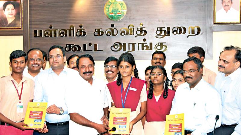School education minister K.A. Sengottaiyan launches the manual for IIT-JEE examination after the state school  education department signed an MoU with two  institutions to impart free coaching to the students for competitive examinations including the Neet. School  education secretary Pradeep Yadav and M.K. Vinayak of Speed Institute are also seen. (Photo: DC)