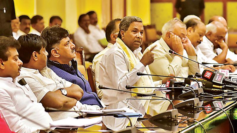 Flanked by his Cabinet colleagues, Chief Minister Siddaramaiah addresses the media in Bengaluru on Friday (Photo:  DC)