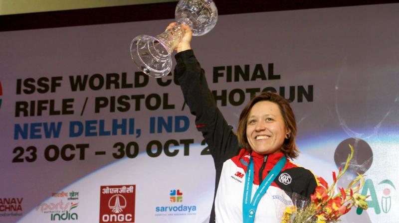Germanys Jolyn Beer poses with her gold medal and trophy.
