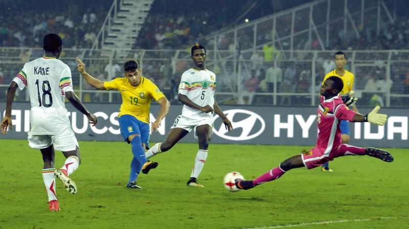 Brazils Yuri Alberto (left) scores against Mali in their U-17 World Cup third-place playoff on Saturday. Brazil won 2-0. (Photo: Asian Age)