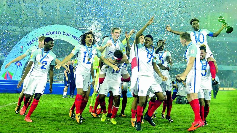 England enjoy their moment to the hilt after winning the Under-17 World Cup final in Kolkata on Sunday. (Photo: Pritam Bandyopadhyay