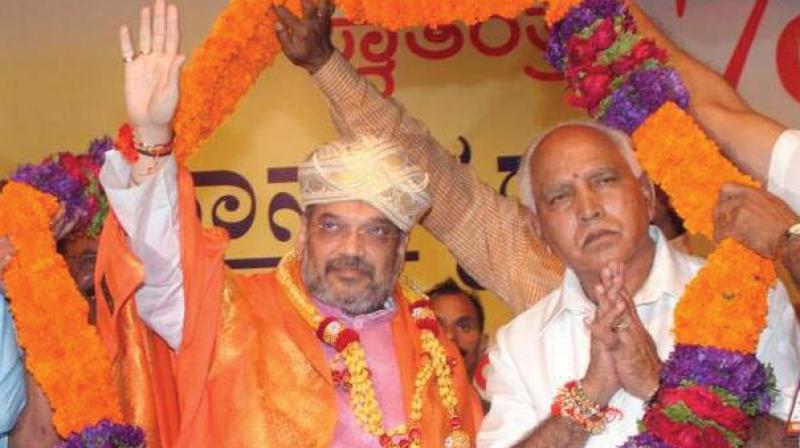 A file photo of BJP state president B.S. Yeddyurappa and national president Amit Shah, who will launch the partys Parivarthana Yatra at Peenya in Bengaluru on Thursday