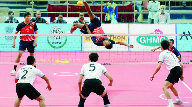 A player from the Indian team smashes during the Sepak Takraw World Cup match against China at the Gachibowli Stadium in Hyderabad on Friday.
