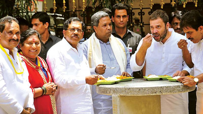 Chief Minister Siddaramaiah, Bengaluru Development Minister K.J. George and Congress vice-president Rahul Gandhi at the launch of Indira Canteen in this file photo