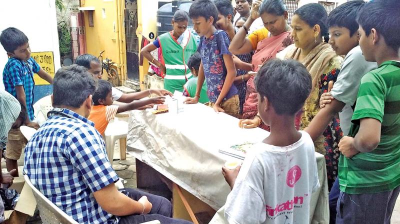Residents flock to a medical camp in Ramapuram on Sunday. (Photo: DC)