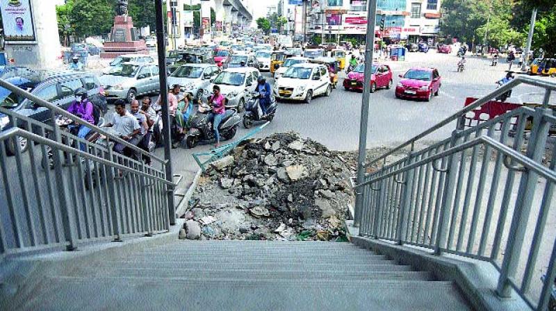 Commuters are set to have a tough time as the Rasoolpura staircase exits onto the main road. (Pics: S. Surender Reddy and  R. Pavan)