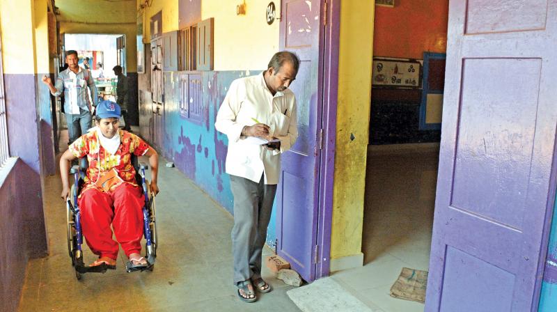 Members of Disability Alliance India on Saturday inspect  polling booths at a corporation school in RK Nagar. (Phot: DC)